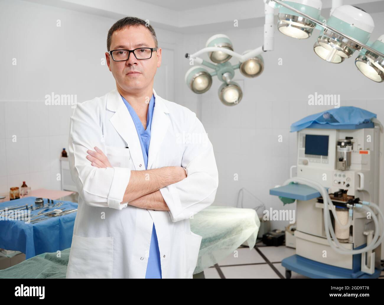 Portrait of man surgeon in glasses looking at camera with serious ...