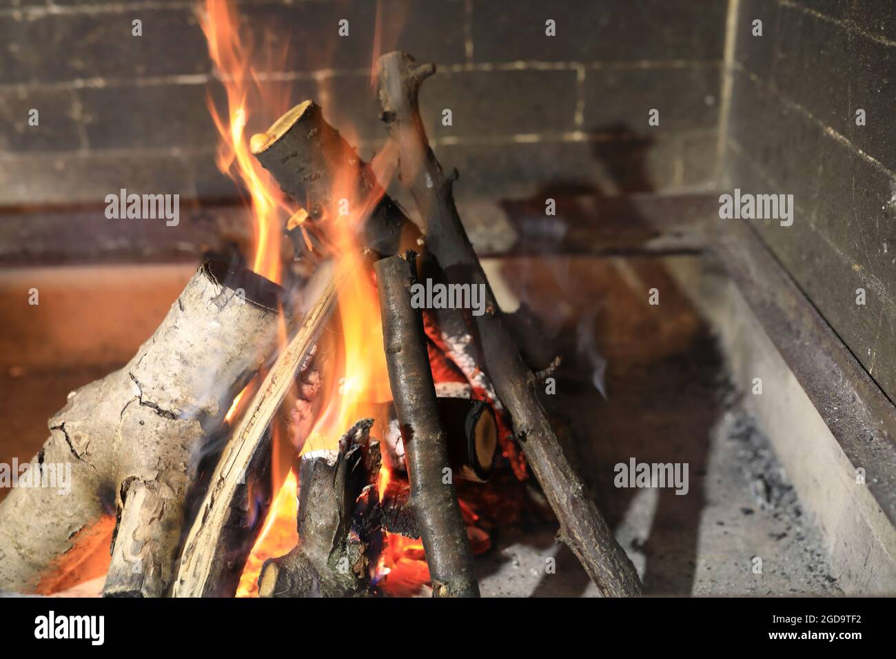 View of burning wood in the fireplace Stock Photo - Alamy