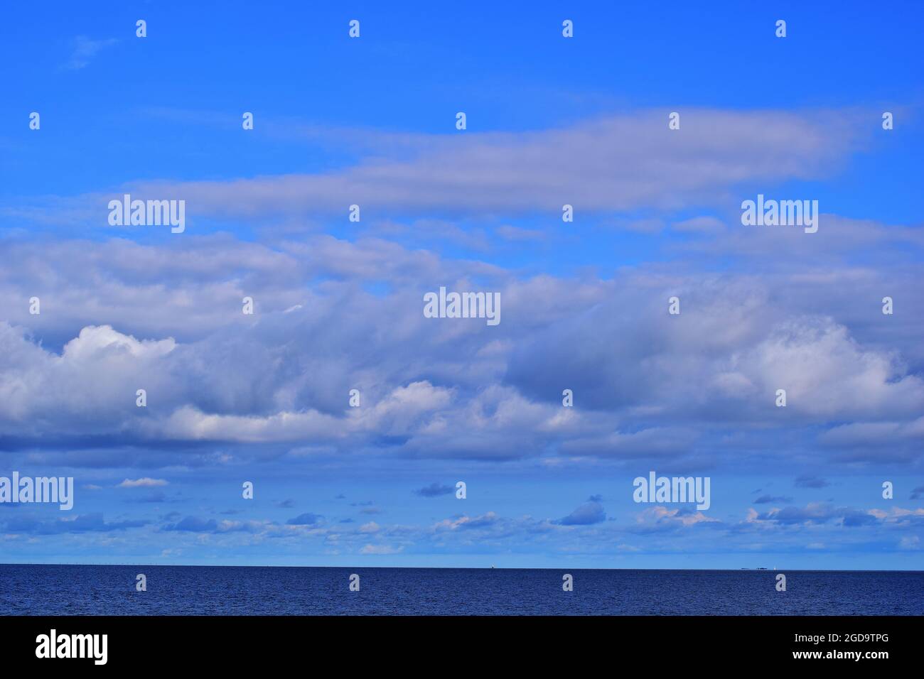 Blue sky with white clouds above the North Sea Stock Photo - Alamy
