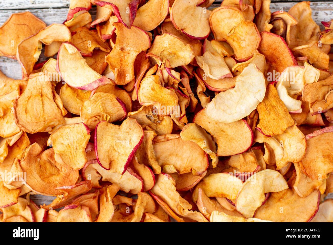 A pile of dried apples in slices. Dried fruit chips. Healthy food. Top