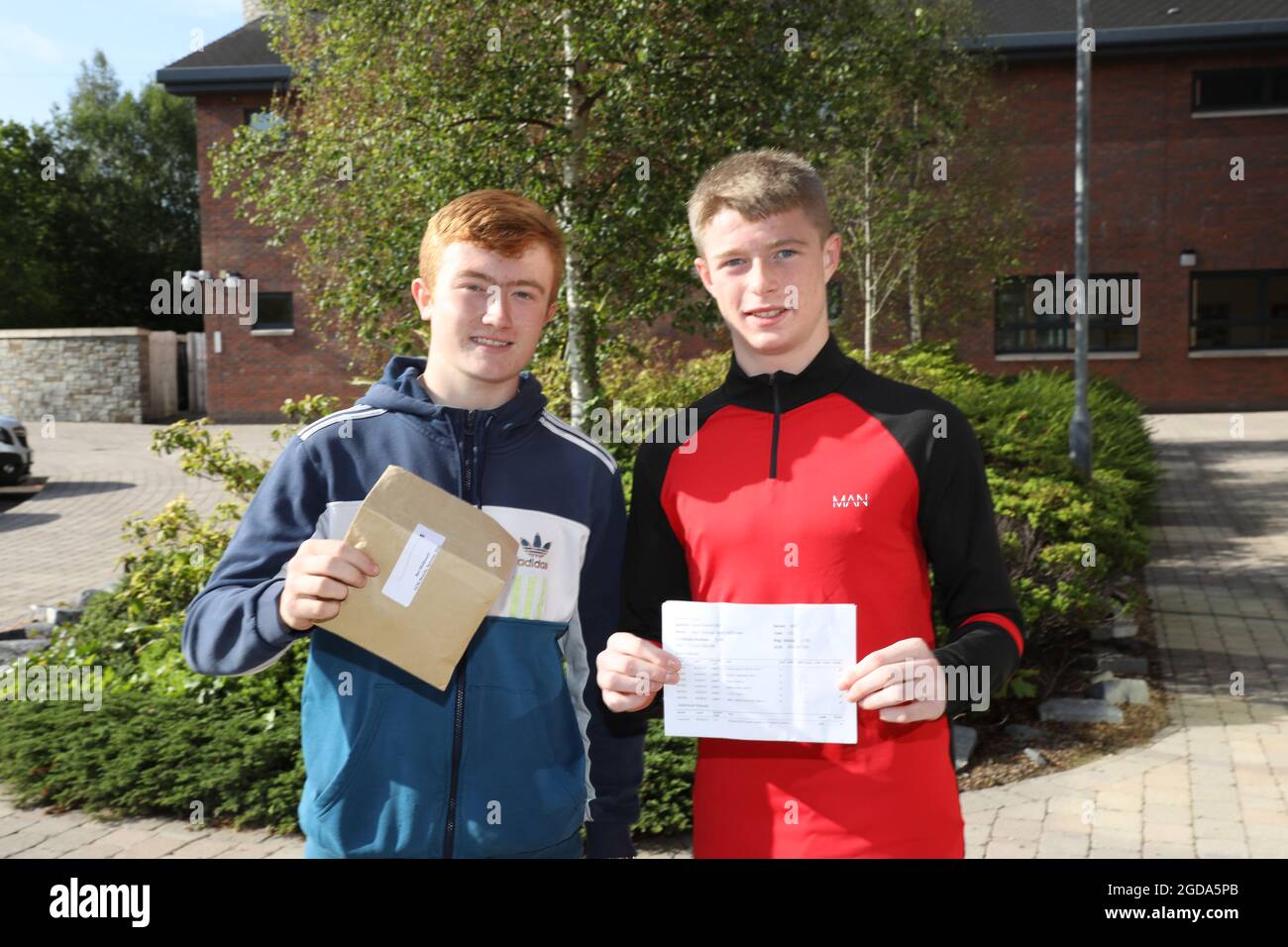 Rhys Halliday (left) and Ben McDowell with their GCSE results at Nendrum College, Comber in County Down. Picture date: Thursday August 12, 2021. Stock Photo