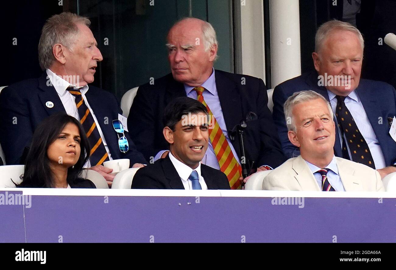 Chancellor of the Exchequer Rishi Sunak (front centre) alongside his wife Akshata Murthy in the stands during day one of the cinch Second Test match at Lord's, London. Picture date: Thursday August 12, 2021. Stock Photo