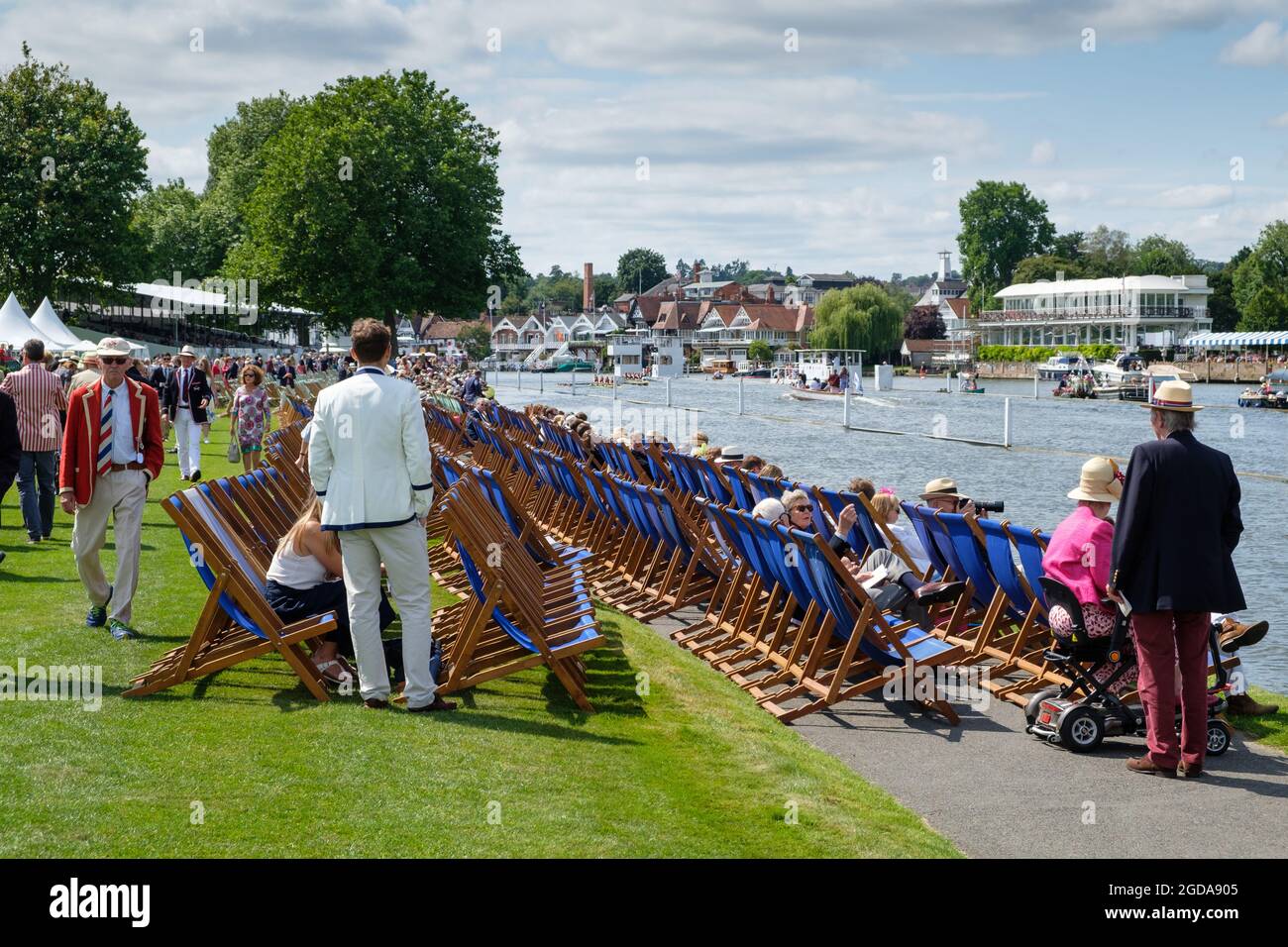 A race followed by the Umpires Launch passes the Stewards Enclosure at the 2021 Henley Royal Regatta, increased in size for the COVID pandemic Stock Photo