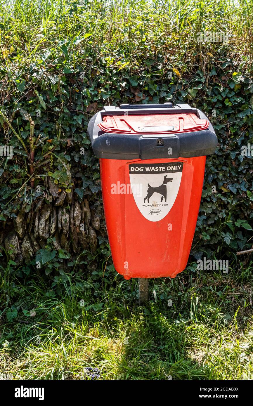 A dog waste disposal bin in a country lane Stock Photo Alamy