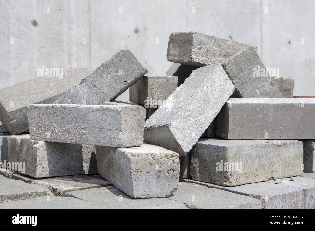 A pile of cement type bricks. Solid brick is used for construction. Lots of loose concrete