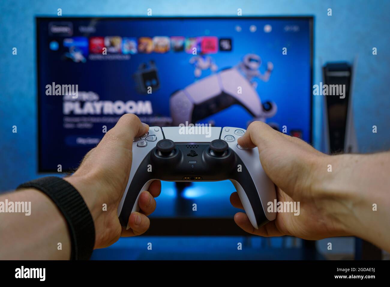 Sony PlayStation 5. New generation gaming computer. PS5 controller. Man  playing video games Stock Photo - Alamy