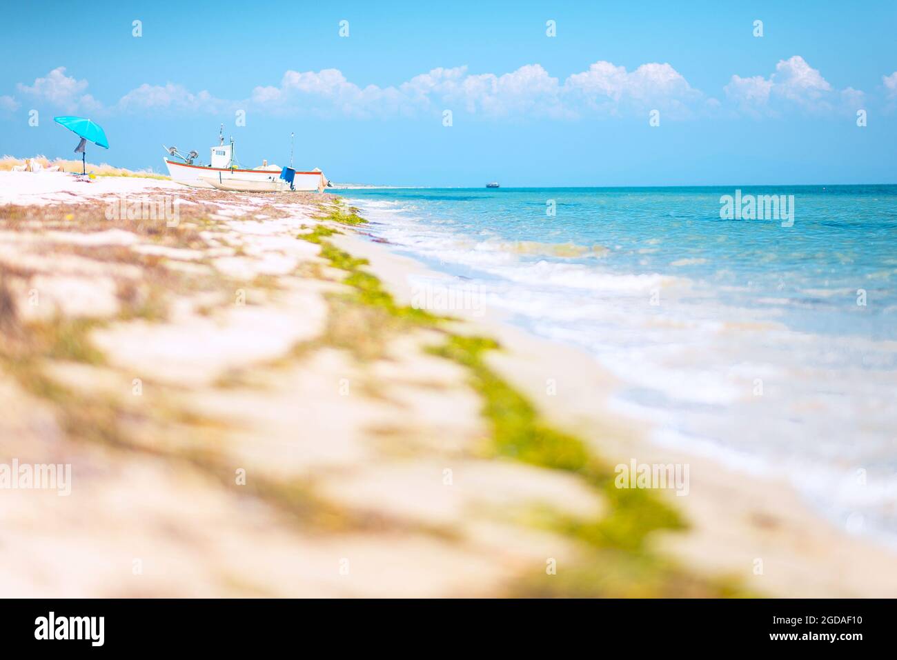 Small boats on the beach in Greece Stock Photo