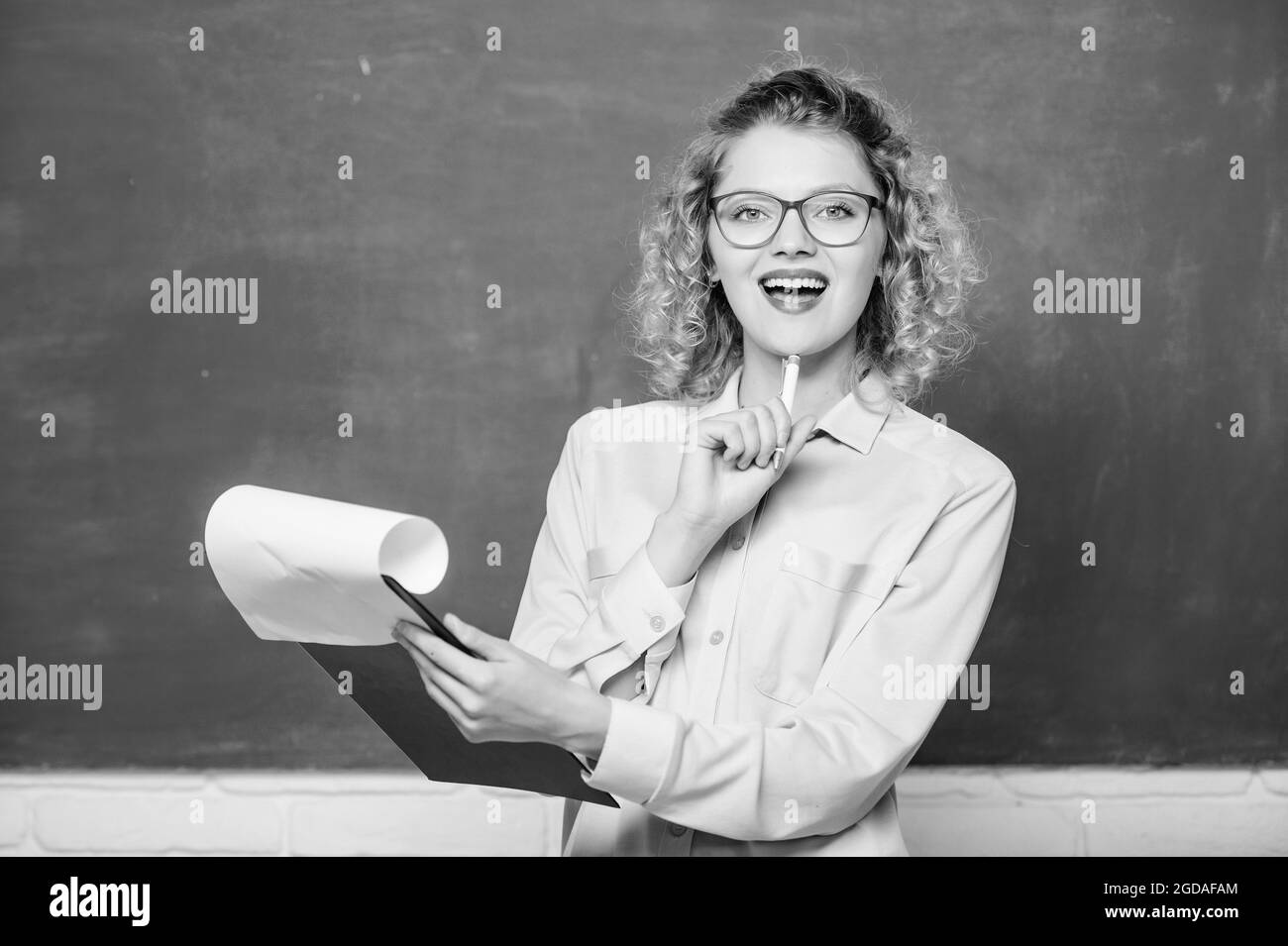 Really busy. report project. back to school. teacher with document folder. happy student in glasses at blackboard. new school year. Girl prepare for Stock Photo