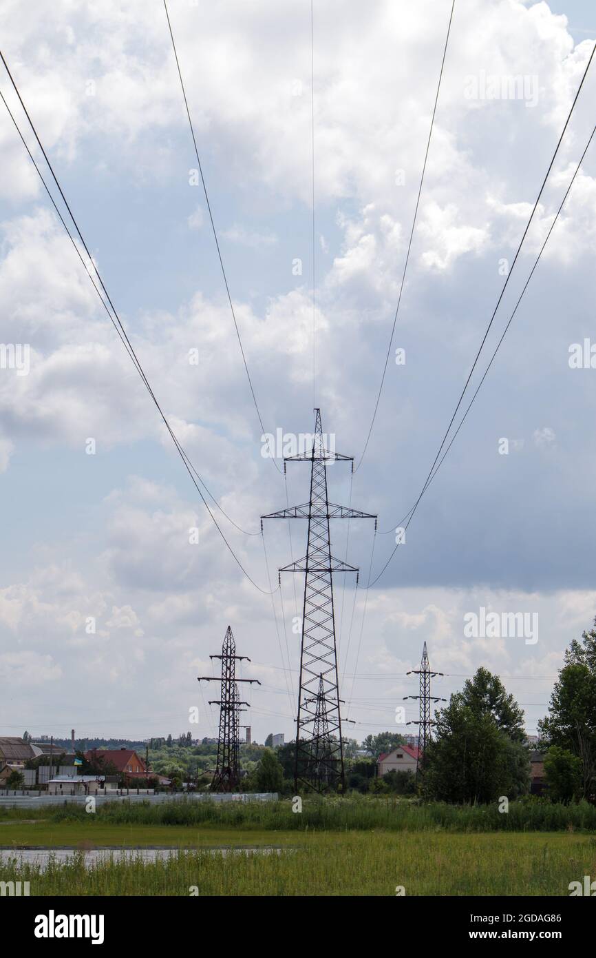 High voltage electrical tower. Power lines and power pylons on a sunny ...
