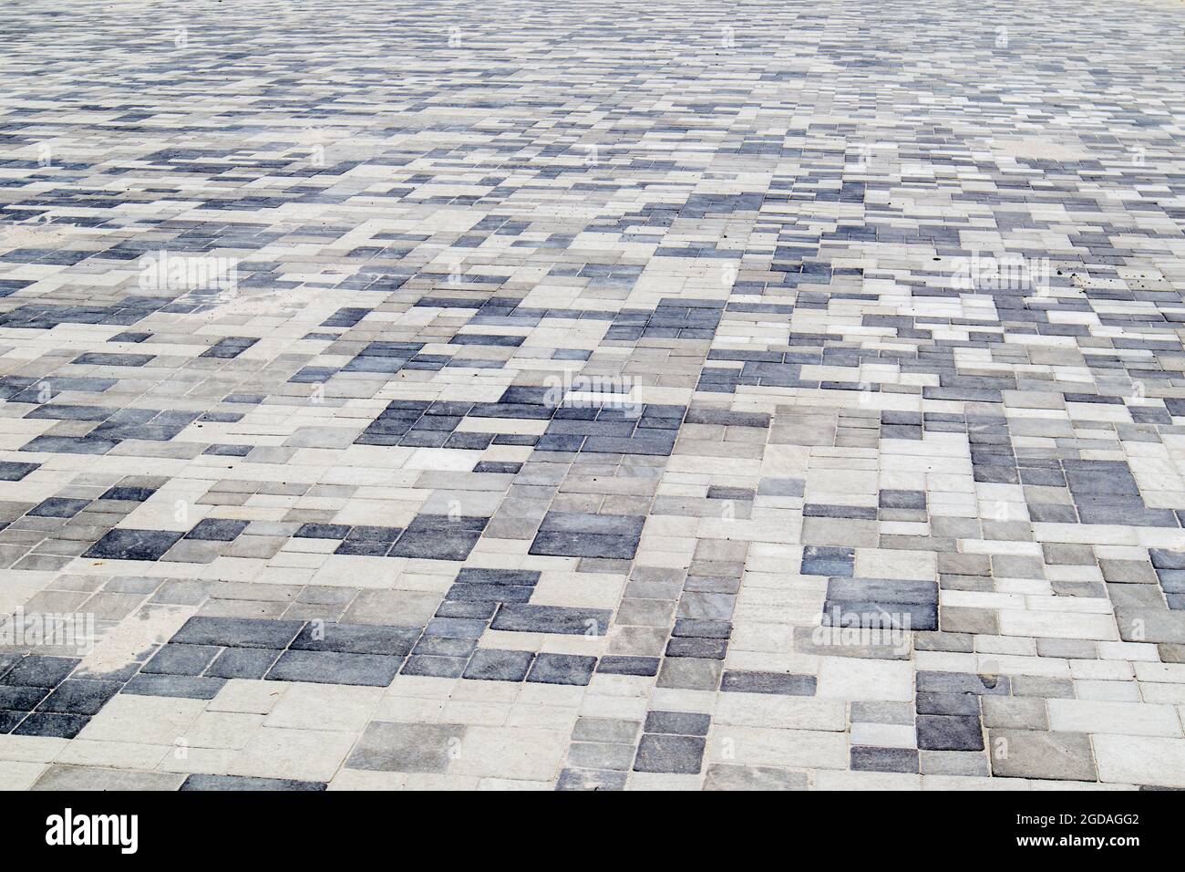 Concrete or paved newly laid gray paving slabs or stones for floors or