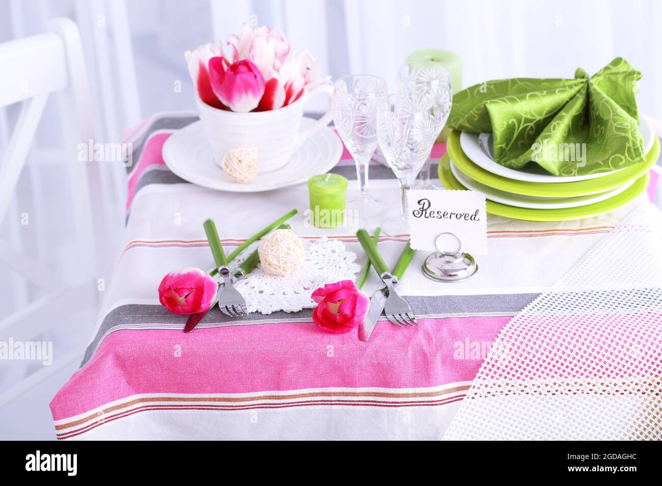 Beautiful spring table setting on light background Stock Photo - Alamy