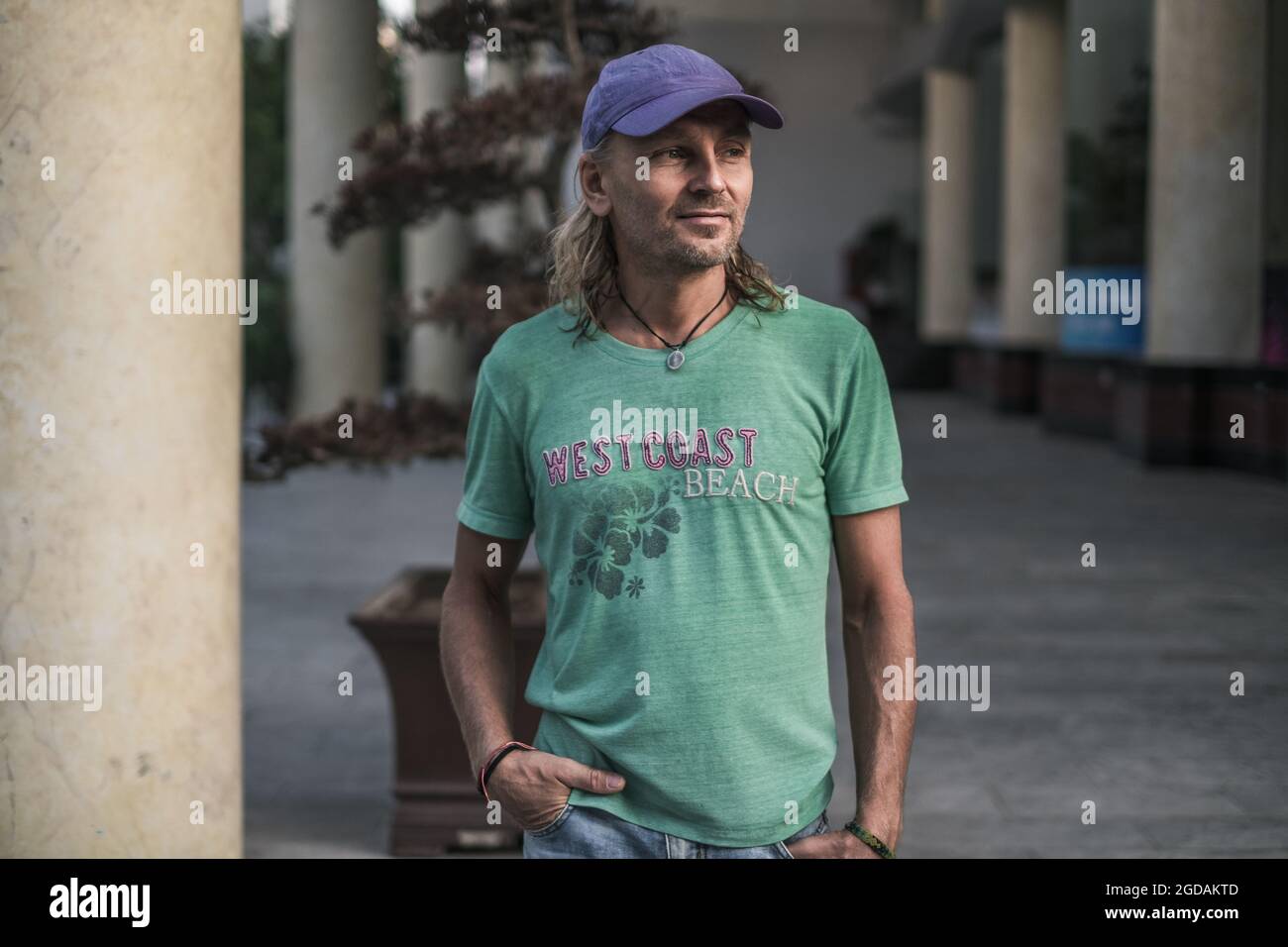 Man in cap blue shirt hi-res stock photography and images - Alamy