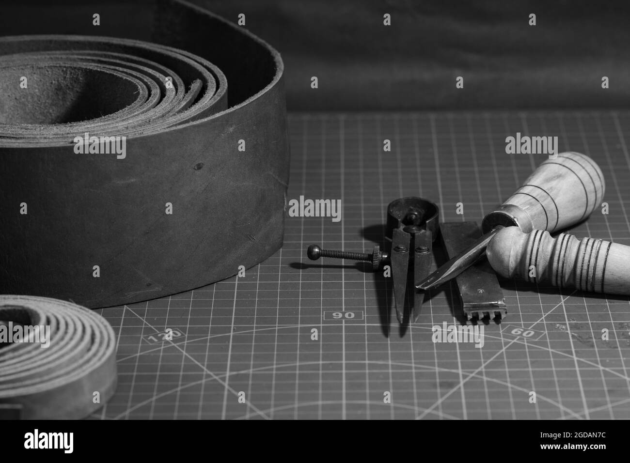 Grayscale closeup of leather crafting equipment Stock Photo Alamy