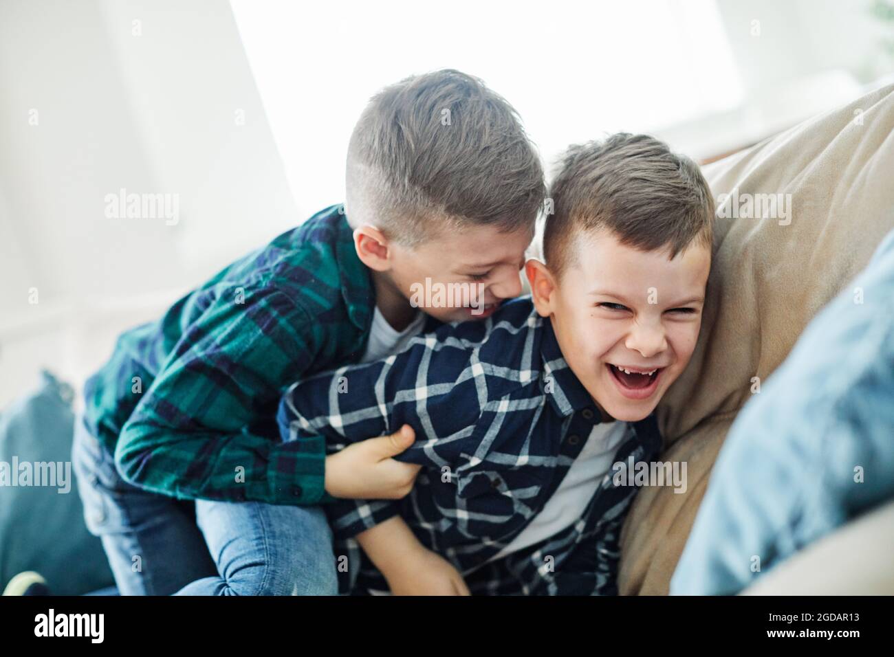 child brother friend having fun playing laughing happy kid Stock Photo