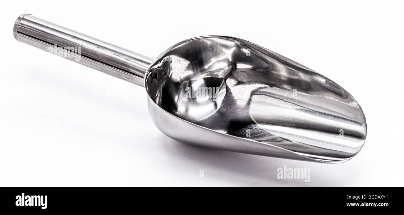 metal measuring spoon on isolated white background. Stock Photo