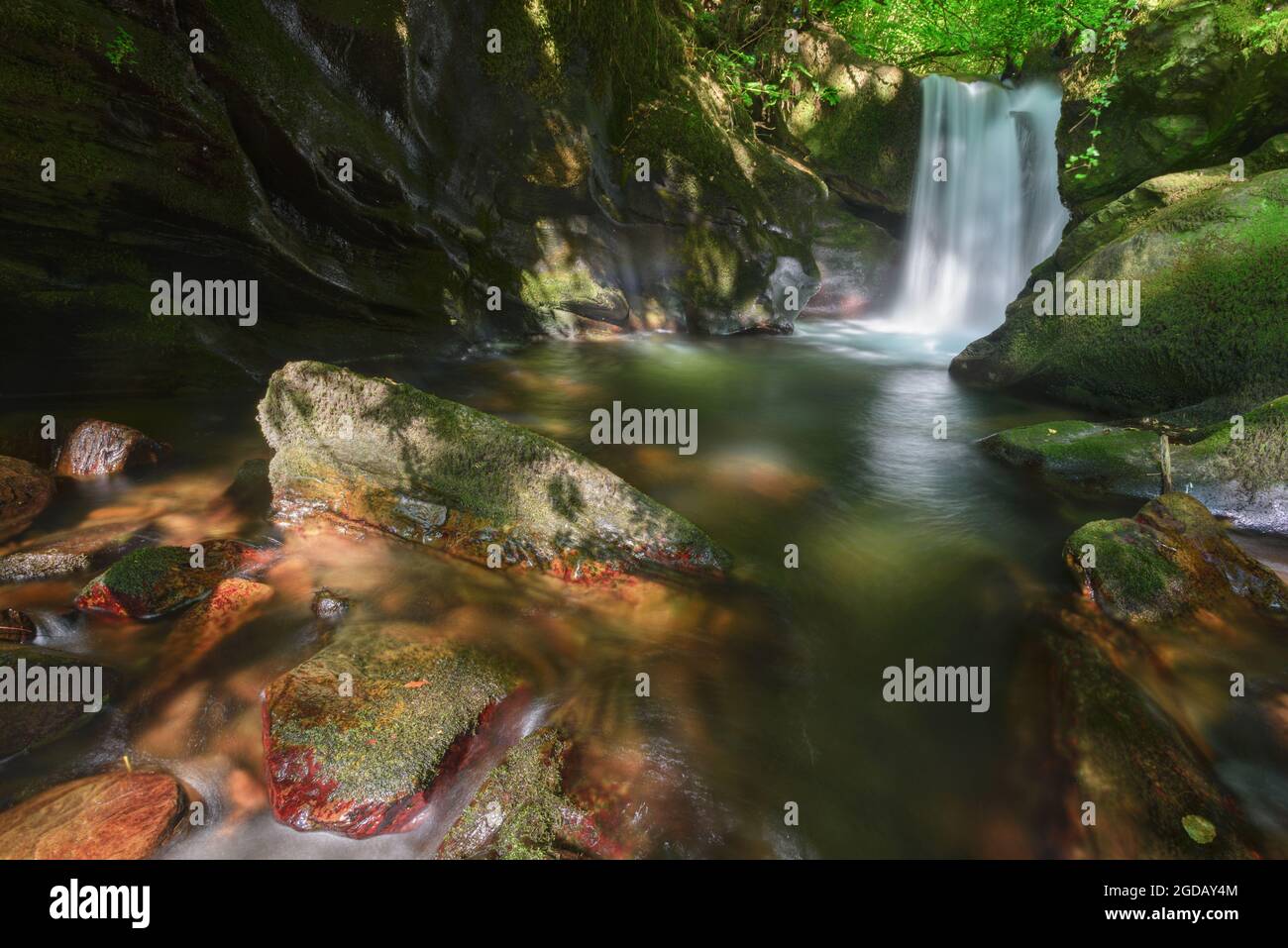 Waterfall and pond in the course of a river in the Courel mountains geopark in Galicia Stock Photo