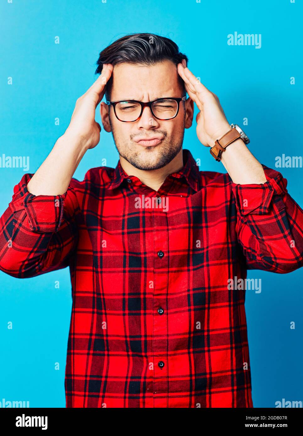 young man boy portrait face blue background Stock Photo