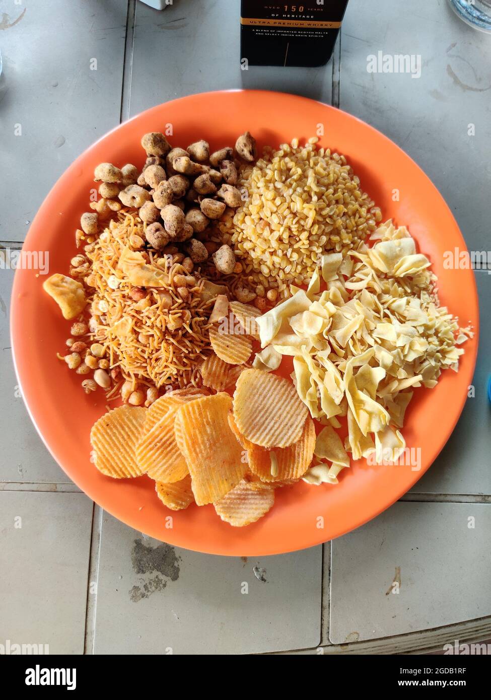 Different types of snacks, chips, nuts and Farsan in still life Stock