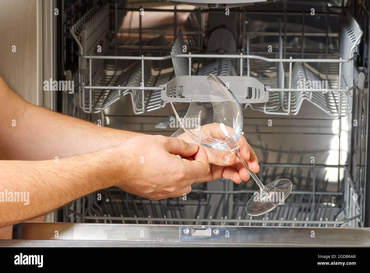 Broken wine glass in dishwasher after washing Stock Photo - Alamy