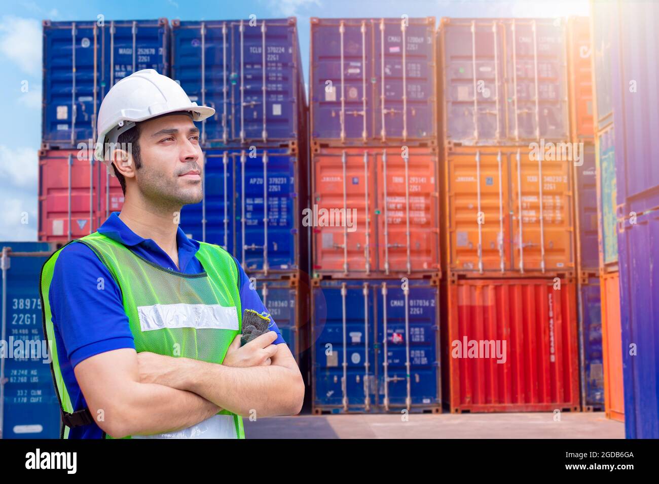 Portrait staff worker work in cargo port shipping for import export industry standing confidence. Stock Photo