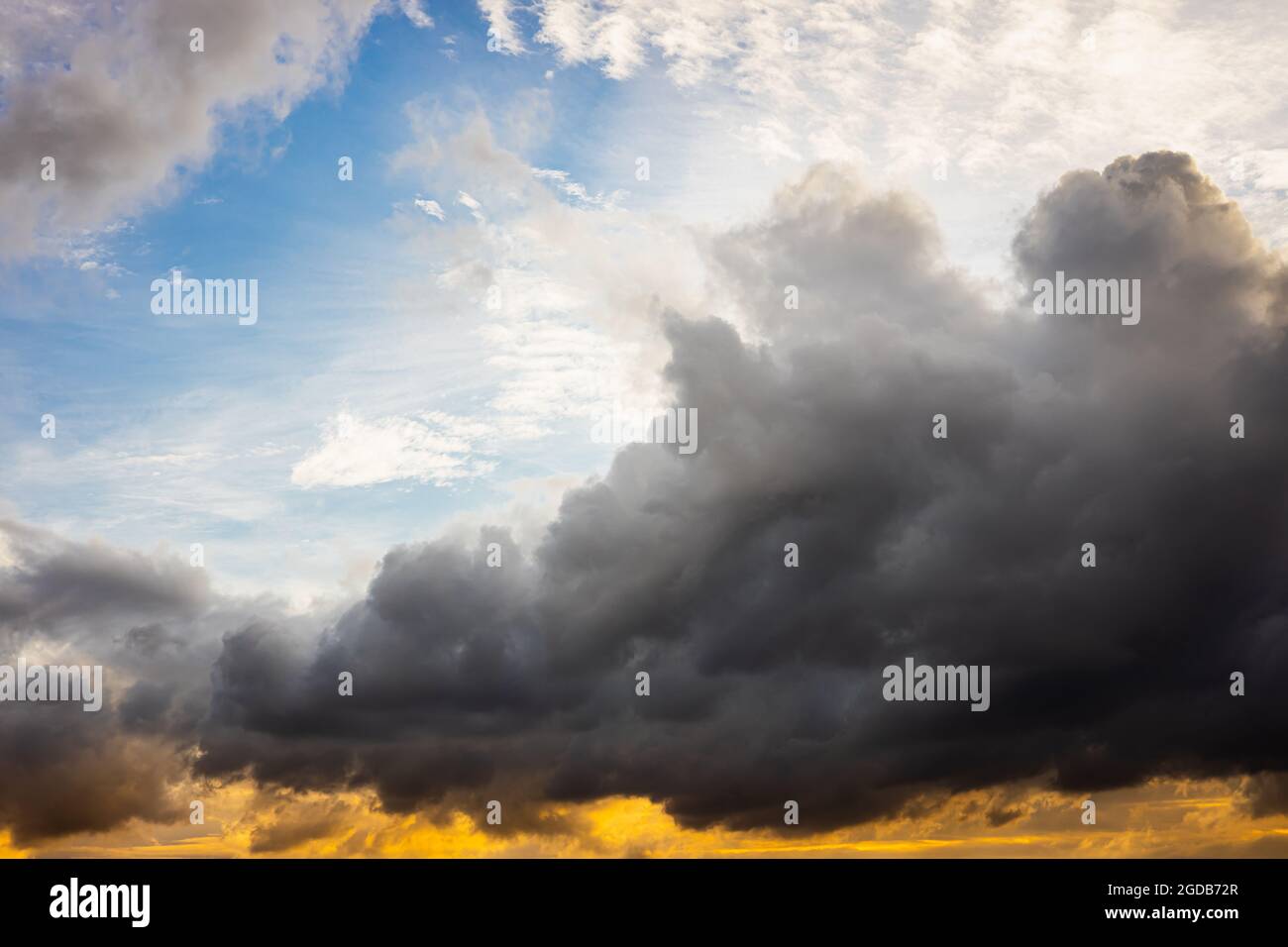 large darkness cloud in the sky with difference sky color from light refraction. Stock Photo