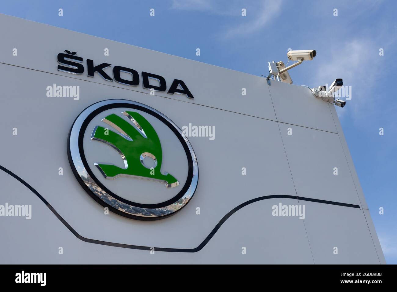 Poznan, POLAND - Jul 30, 2021: Skoda dealership sign. Closeup of skoda logo on whiteboard Stock Photo