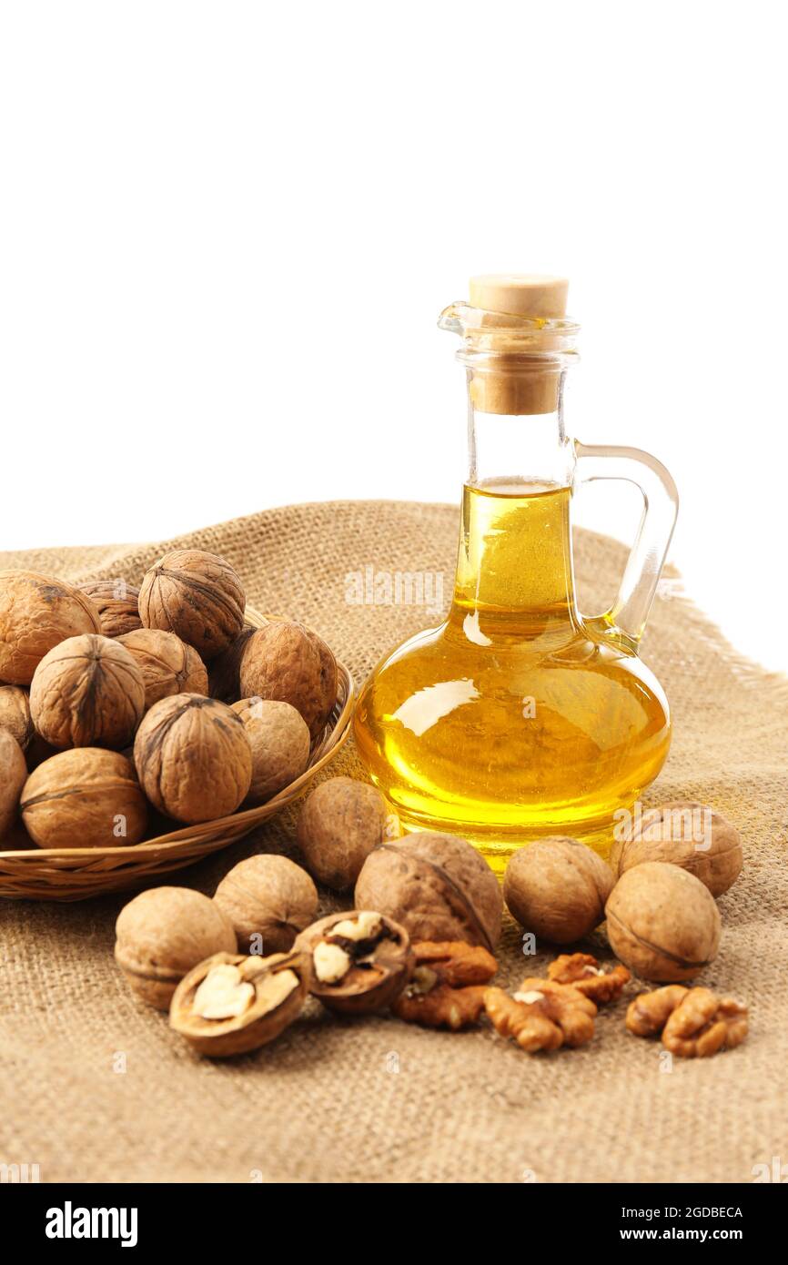 Walnut oil and nuts, isolated on white Stock Photo Alamy