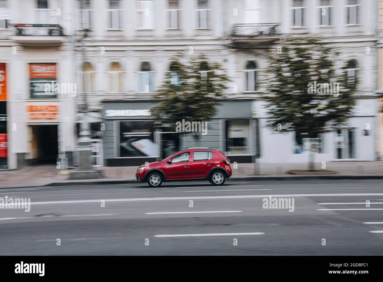 Ukraine, Kyiv - 2 June 2021: Red Dacia Sandero car moving on the street. Editorial Stock Photo