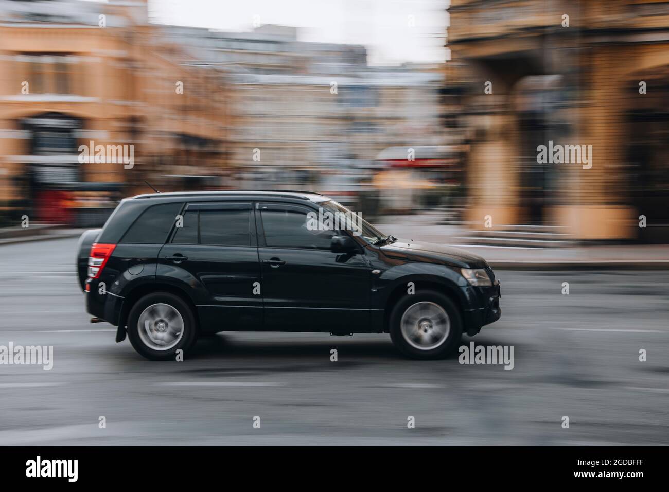 Ukraine, Kyiv - 2 June 2021: Black Suzuki Grand Vitara car moving on the street. Editorial Stock Photo
