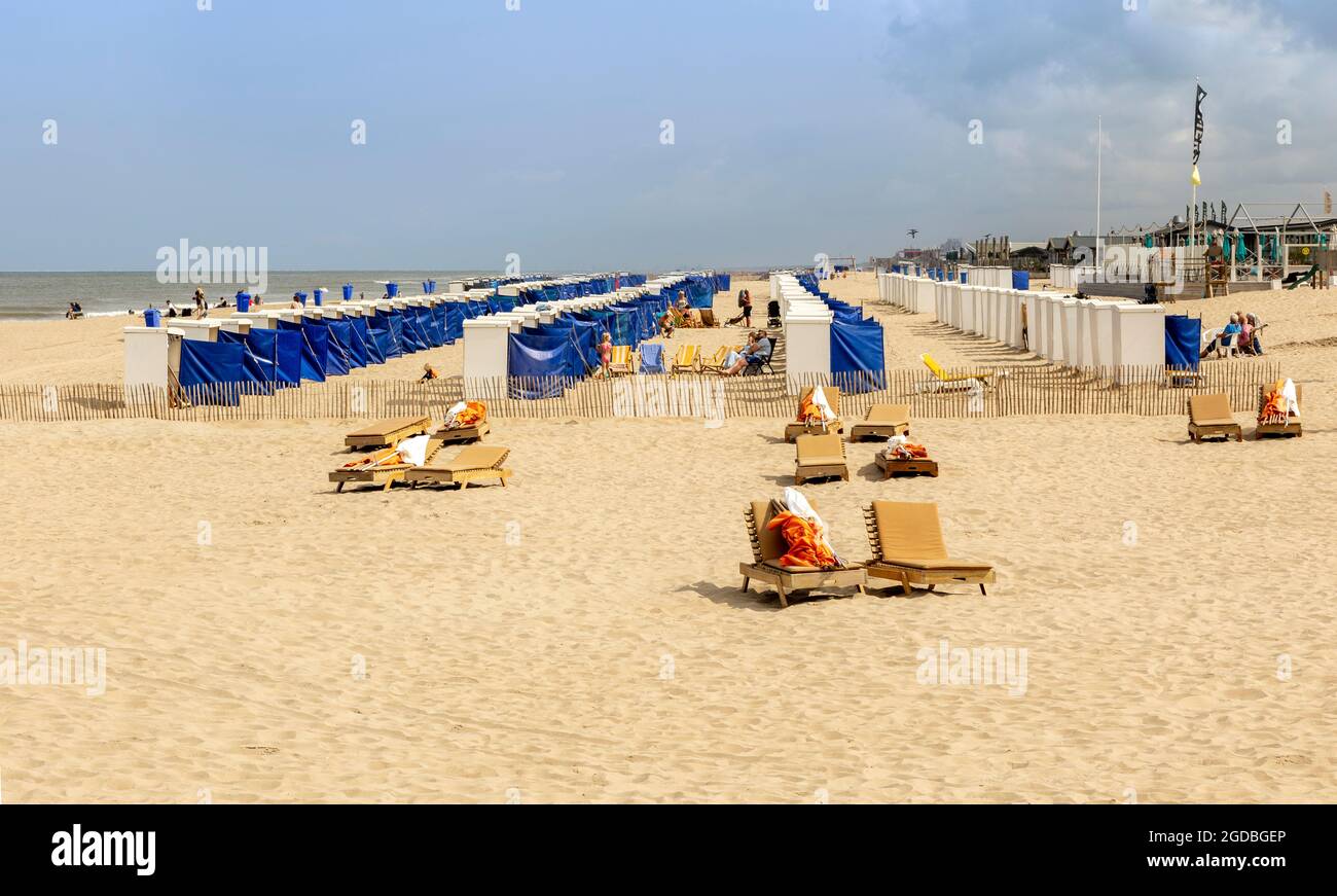 Summertime along the North Sea People relaxing and sunbathing on the