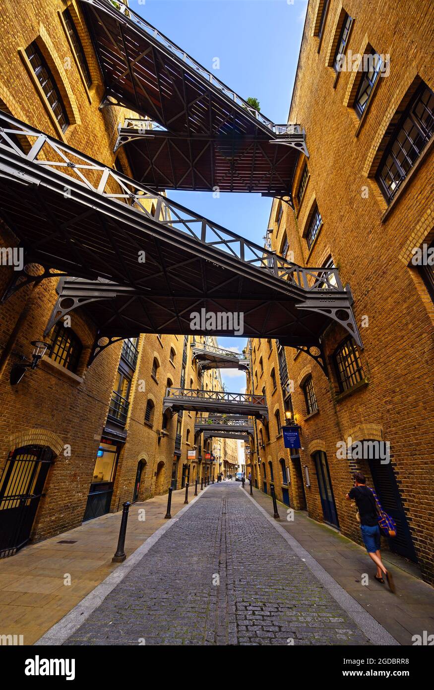 Historic Shad Thames in London near Tower Bridge. This old cobbled street in Bermondsey is known for its overhead walkways. Stock Photo