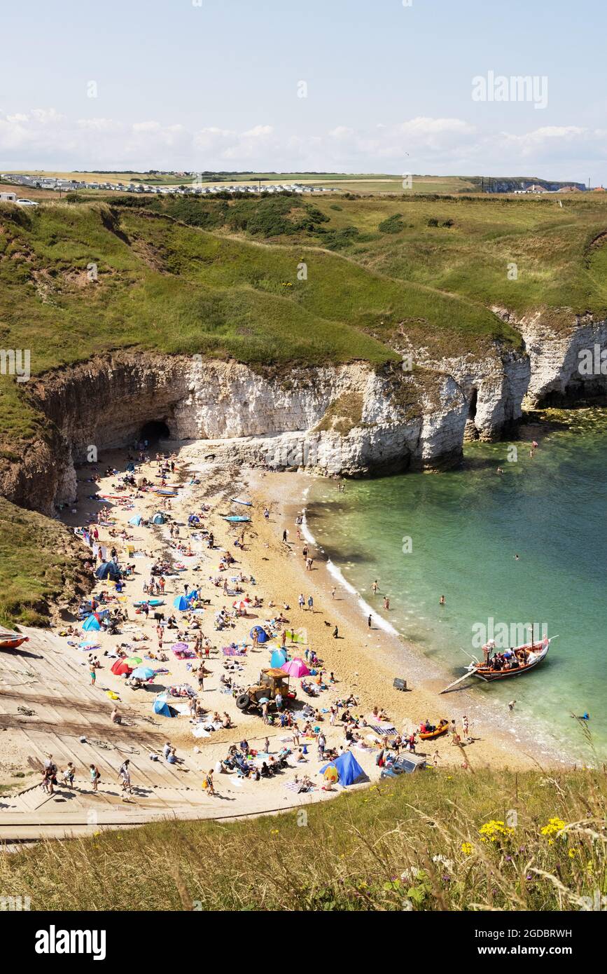 Yorkshire beach; people sunbathing on a hot sunny day in summer