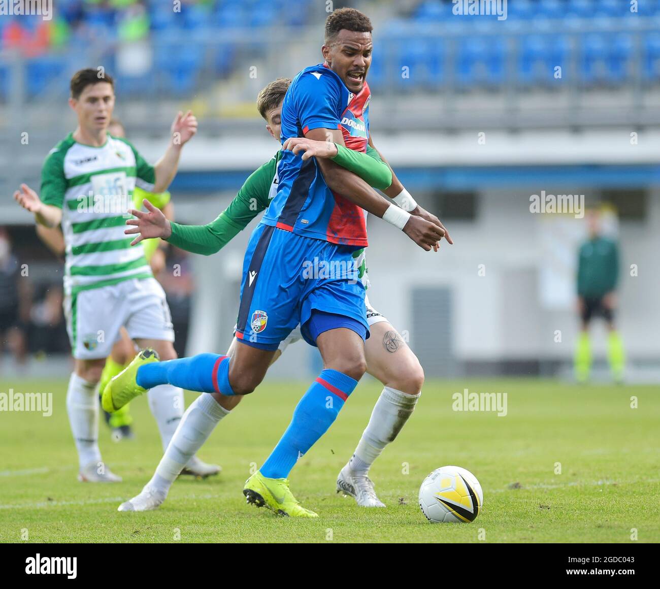 Pilsen, Czech Republic. 12th Aug, 2021. (L-R) Keston Davies of TNS and  Jean-David Beauguel of Plzen in action during the European Football  Conference League 3rd qualifying round return match Viktoria Plzen vs