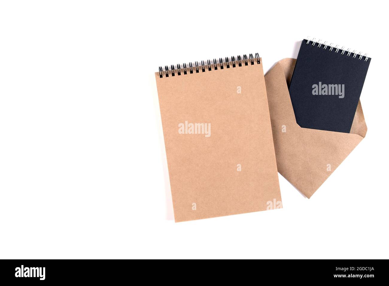 Blank spiral notepads and a recycled envelope Stock Photo