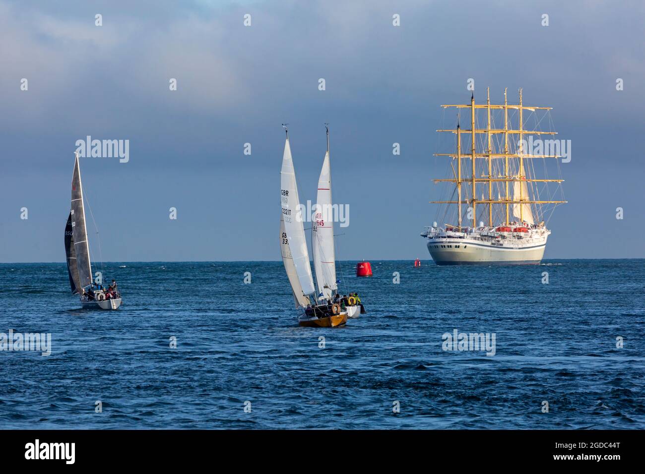 Poole, Dorset, UK. 12th Aug, 2021. Golden Horizon luxury cruise ship, the World's largest square-rigged sailing vessel, five-mast, iron-hulled cruise liner, departs from Poole Harbour, in the evening light. Credit: Carolyn Jenkins/Alamy Live News Stock Photo