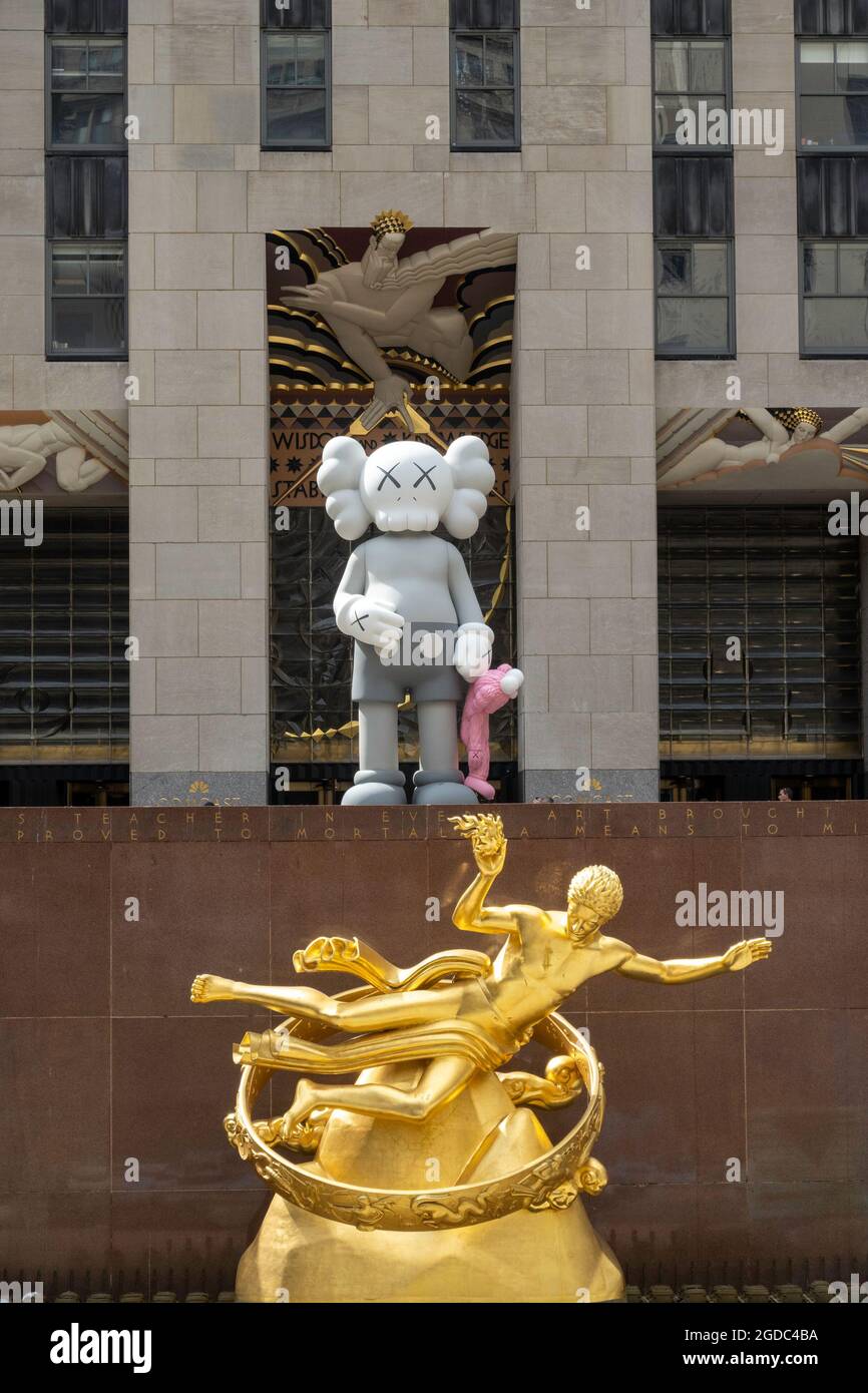 SHARE is a sculpture by KAWS on the Rockefeller Center Plaza, New York