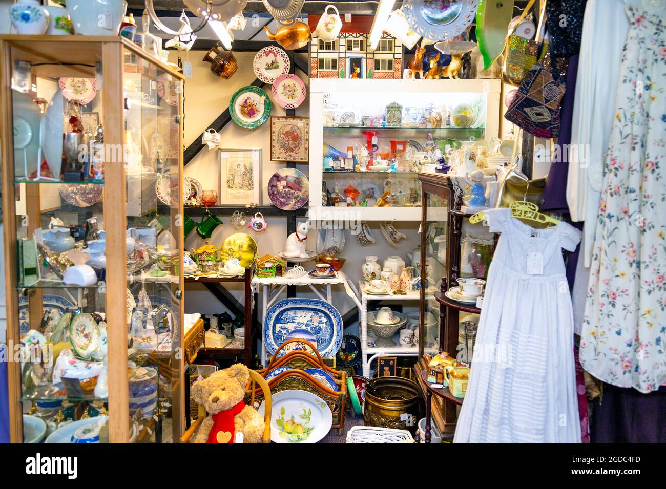 Shelves and display cabinets filled with antiques at Herts & Essex Antiques Centre, Sawbridgeworth, UK Stock Photo