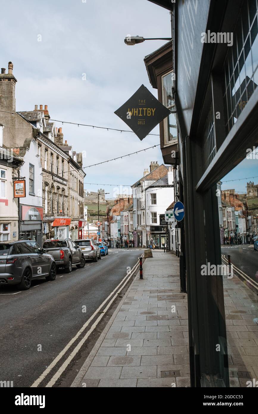 WHITBY, UNITED KINGDOM - Mar 20, 2020: A shot of a street view with parked cars and a shopwindow in the historical seaside town of Whitby, United King Stock Photo