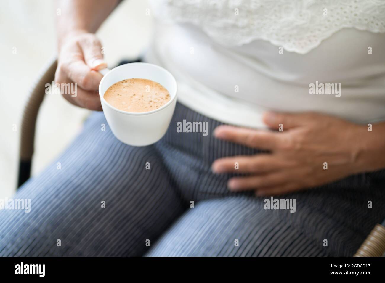 Coffee Stomach Ache. Digesting Acid Pain And Health Risk Stock Photo
