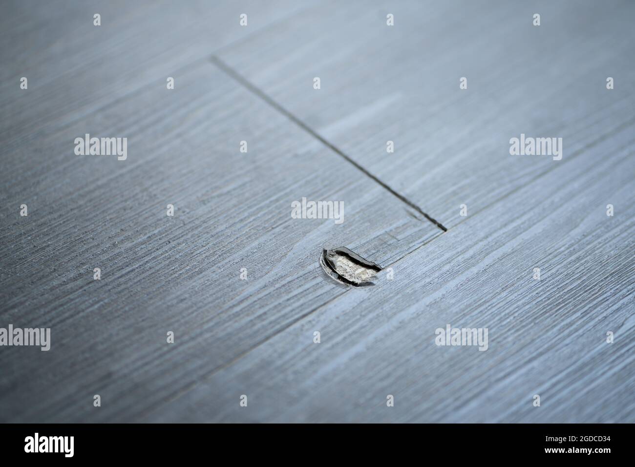 Damaged Wooden Floor. Laminate Scratch. Broken Vinyl Flooring Stock