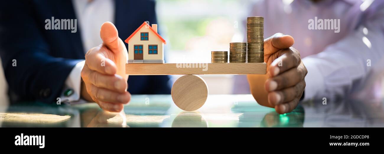 Real Estate House Money Equilibrium On Scale Stock Photo
