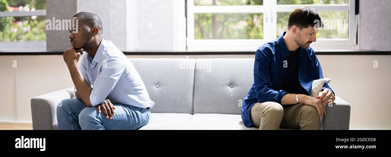 Gay Couple Relationship Conflict And Divorce. Unhappy And Sad Stock Photo