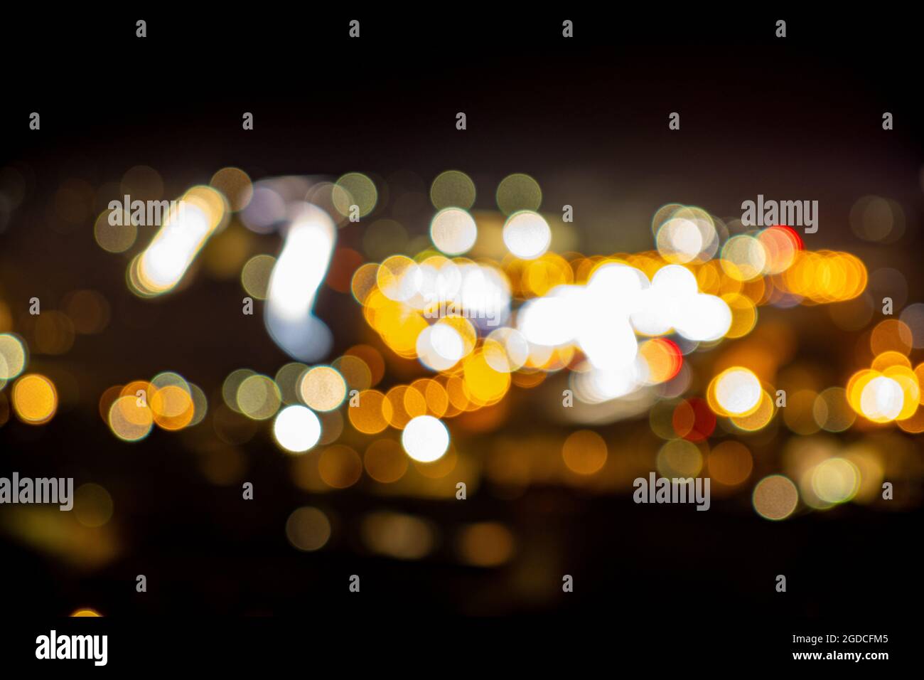 Colorful blurry city lights in a winter night ideal for use as