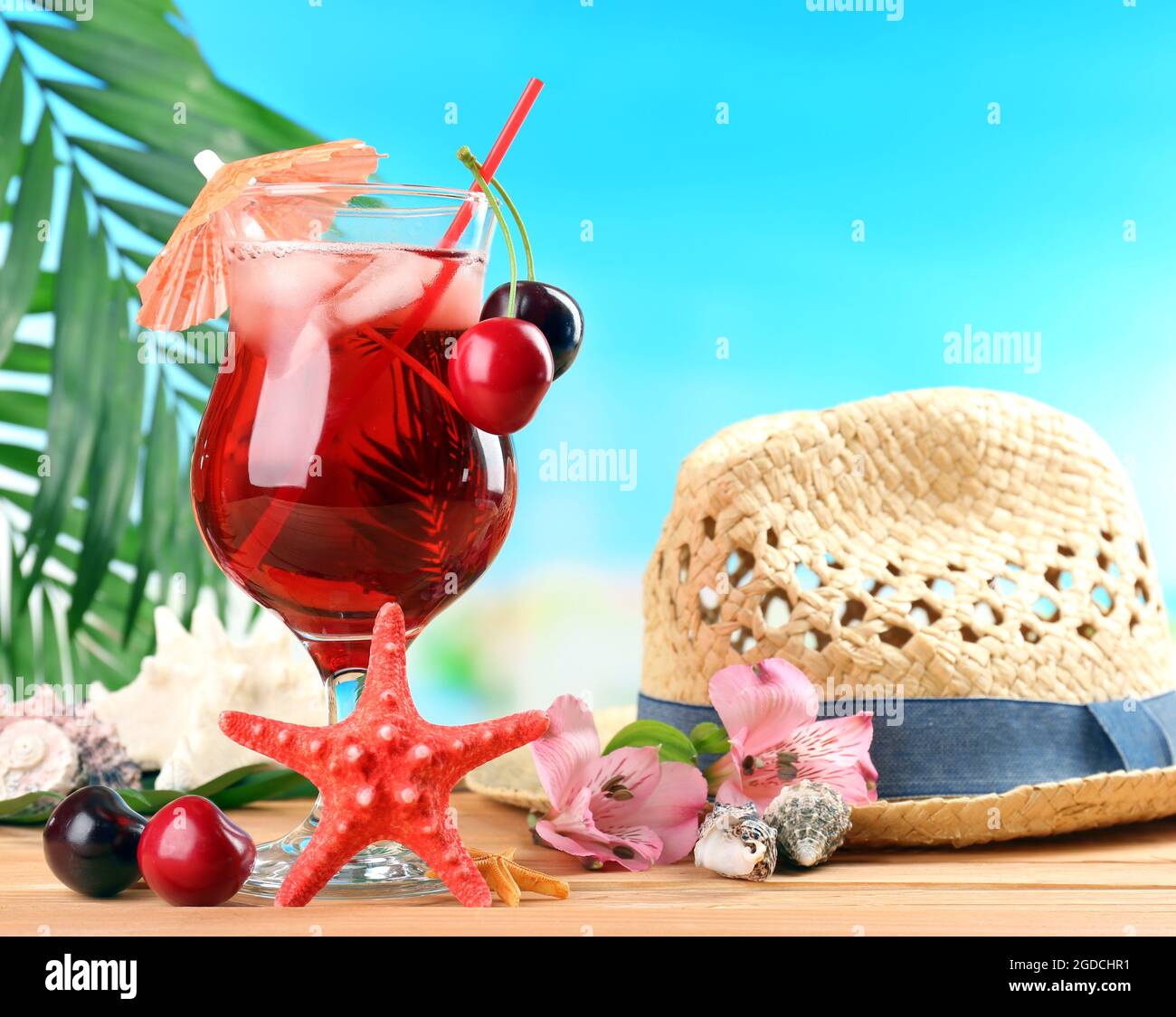 Refreshing cherry cocktail on beach table Stock Photo Alamy