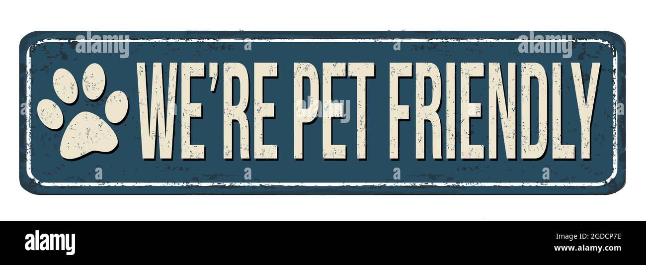 We're pet friendly vintage rusty metal sign on a white background