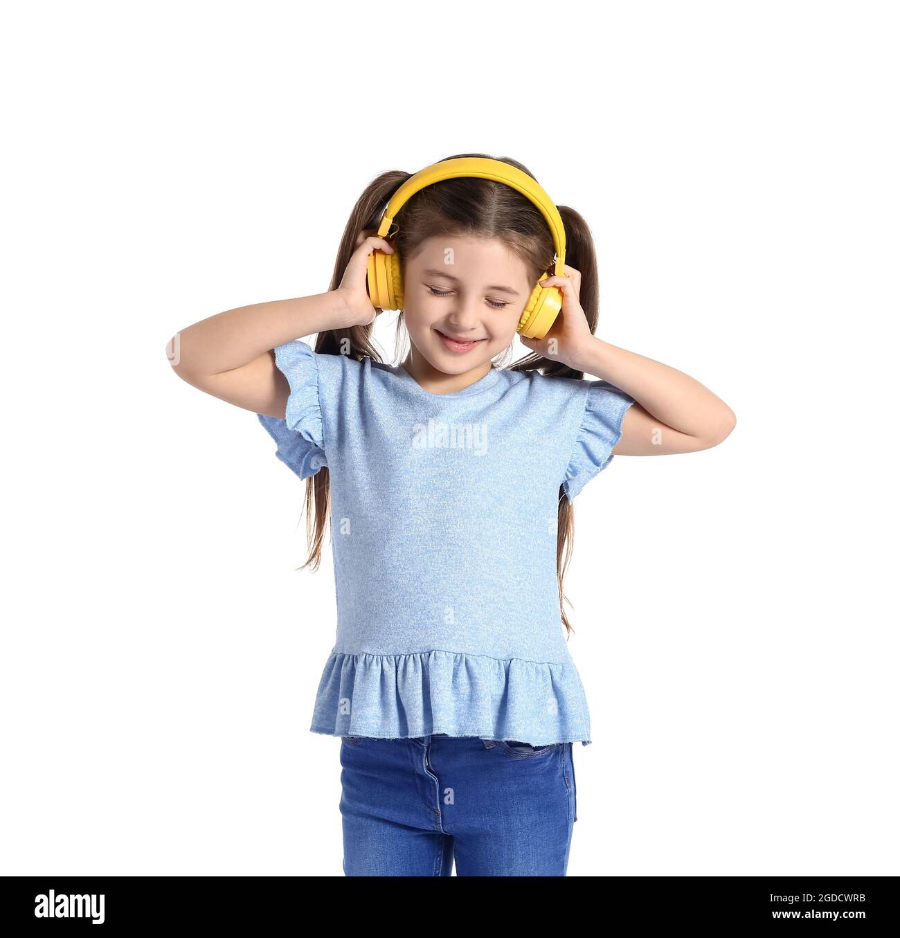 Little girl with headphones on white background Stock Photo - Alamy