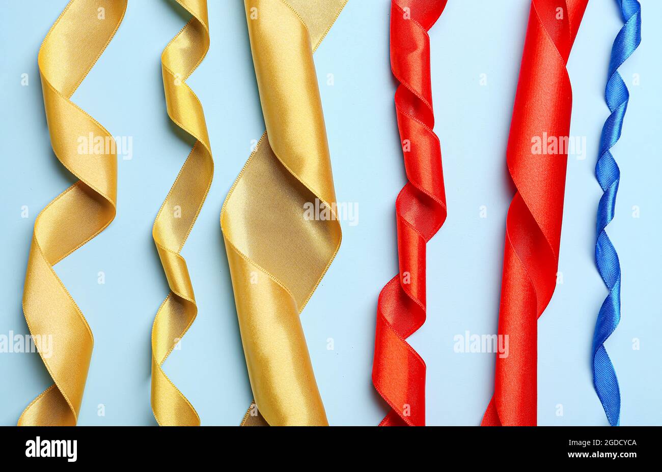 Beautiful ribbons on color background Stock Photo - Alamy