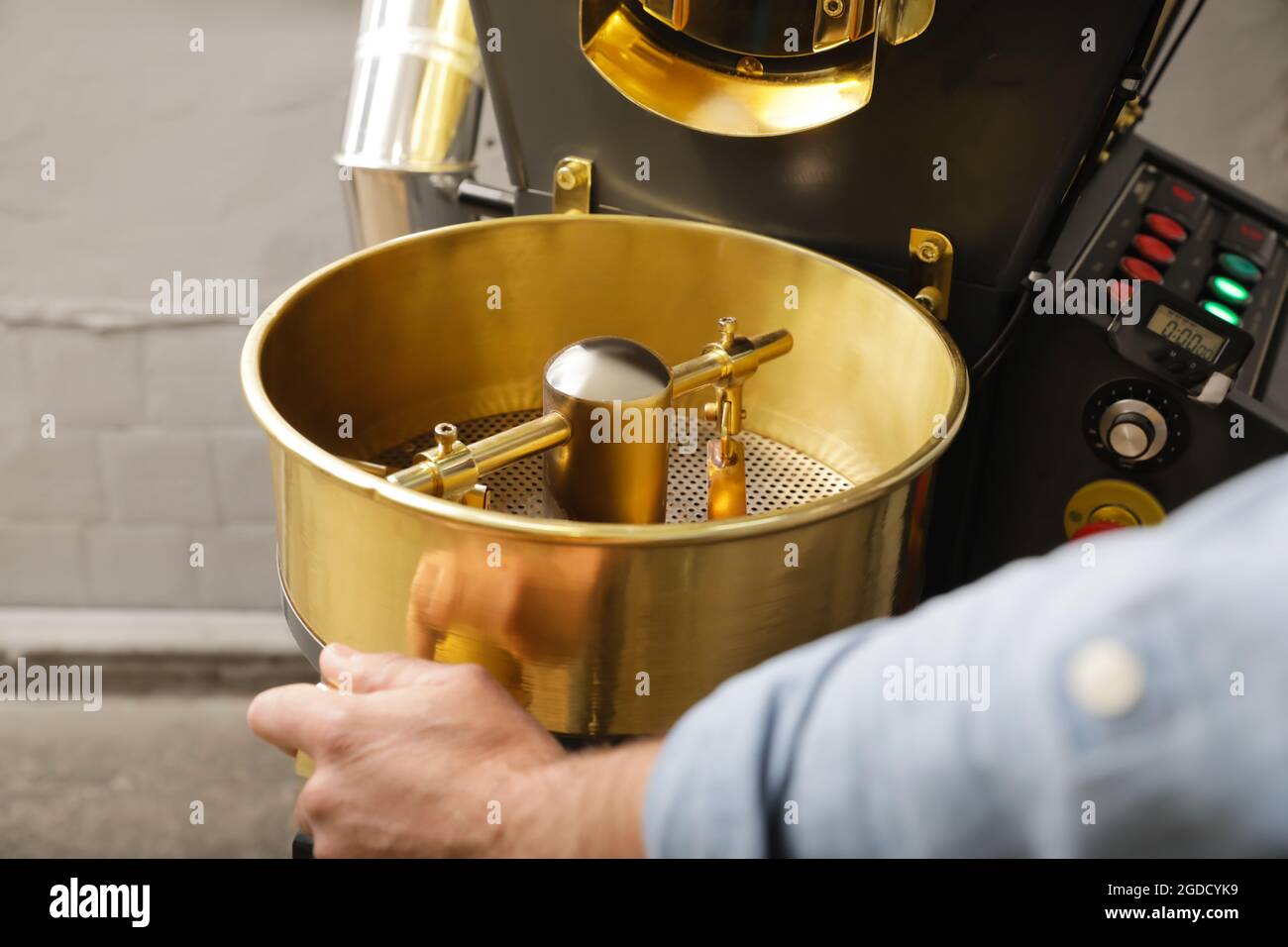 Senior man using modern coffee roaster, closeup Stock Photo Alamy