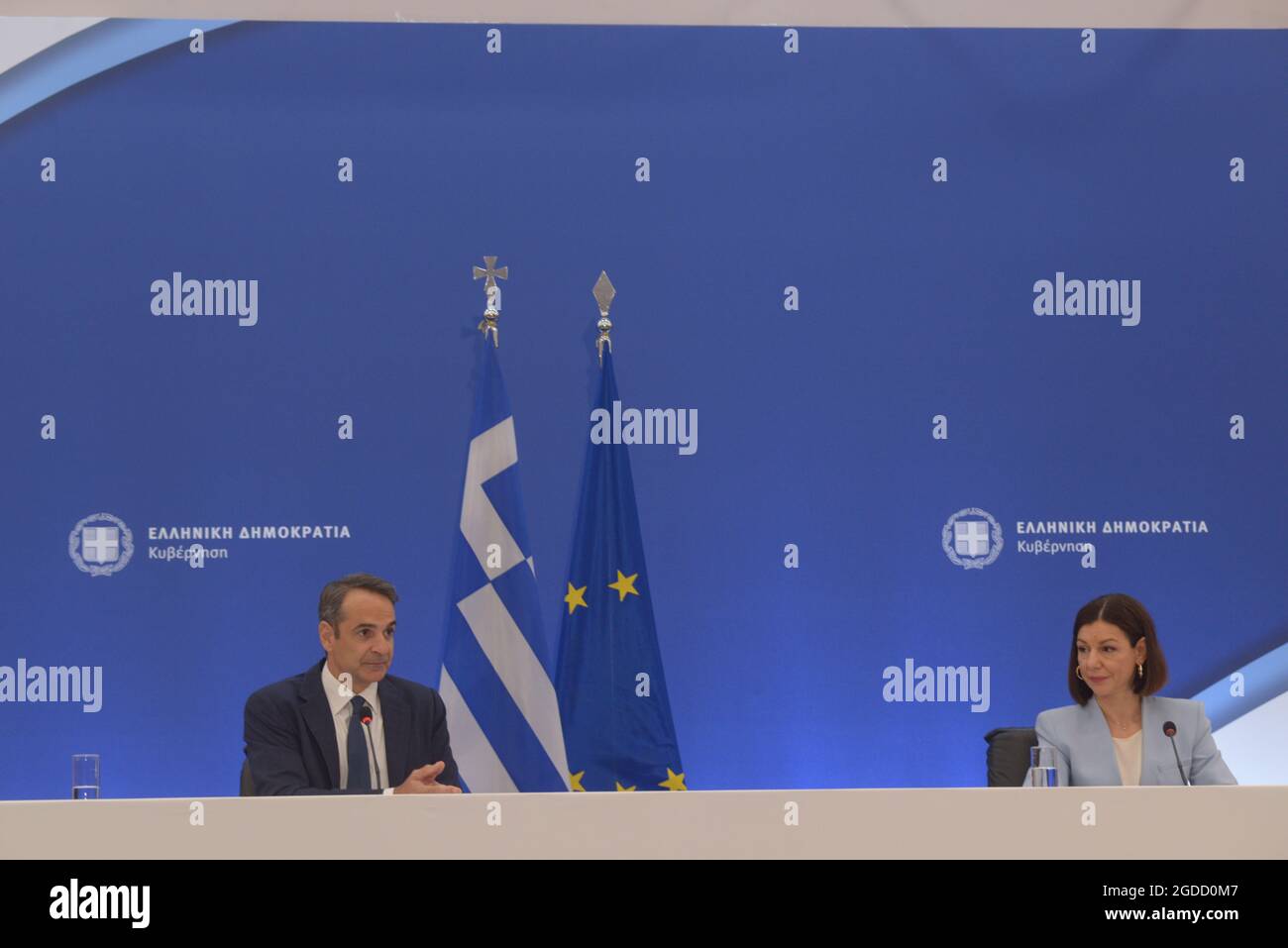 Athens, Greece. 12th Aug, 2021. Greek Prime Minister Kyriakos Mitsotakis (left) and Aristotelia Peloni (right) Government Spokesperson, during the press conference. (Photo by Dimitrios Karvountzis/Pacific Press) Credit: Pacific Press Media Production Corp./Alamy Live News Stock Photo