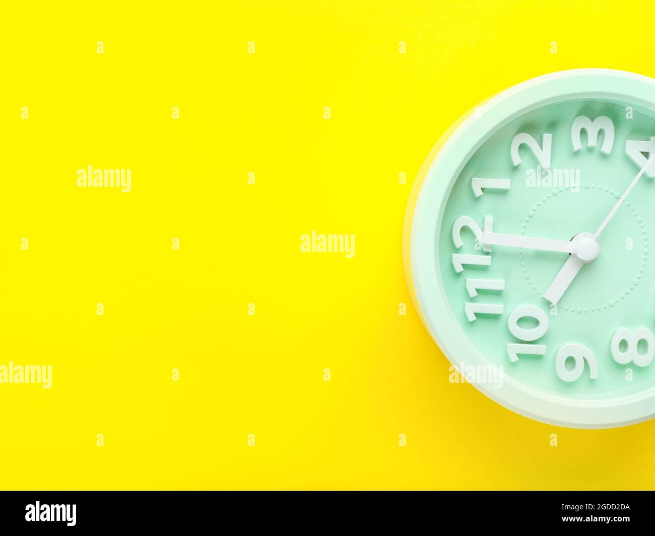 Stylish alarm clock on color background Stock Photo - Alamy